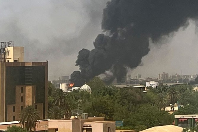 Smoke billows above residential buildings in Khartoum on April 16, 2023. (AFP)