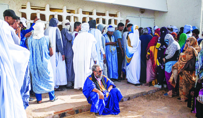 Voters wait to cast their votes at a polling station in Nouakchott on Saturday. (AFP)