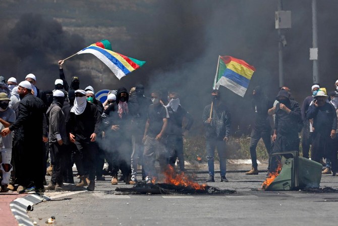 Dozens hurt in protests against wind turbine project in Golan Heights