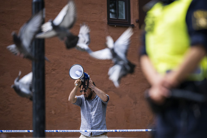 Salwan Momika protests outside a mosque in Stockholm on June 28, 2023, during the Eid Al-Adha holiday. (AFP)