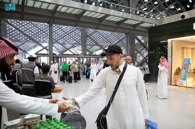 Hajj pilgrims are greeted with Zamzam water and gifts on arrival in Madinah after travelling on the Haramain High-Speed Railway.