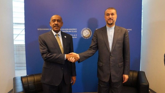 Iranian Foreign Minister Hossein Amirabdollahian shakes hands with Sudan’s acting Foreign Minister, Ali Sadeq, in Baku .