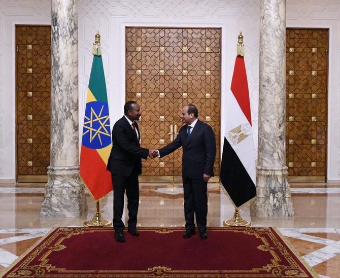 Egyptian President Abdel Fattah El-Sisi shakes hands with Ethiopian Prime Minister Abiy Ahmed after their meeting.