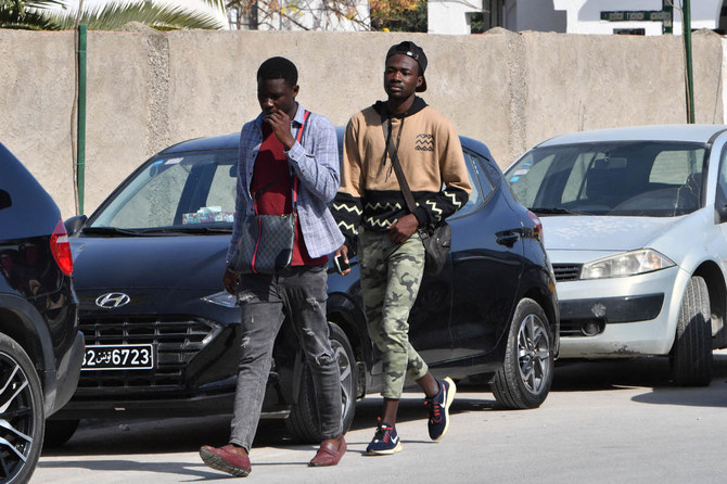 Sub-Saharan African men walk in the popular Ariana souk near Tunis. (AFP file photo)