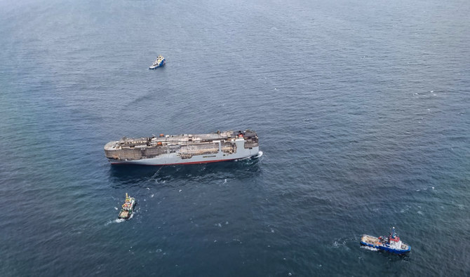 Tugs tow burning cargo ship to new location on North Sea