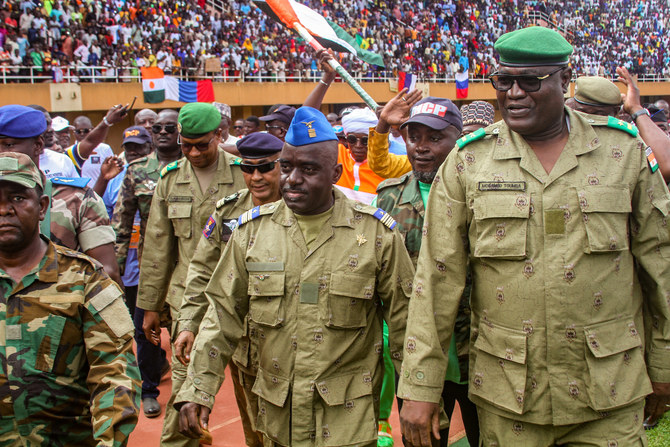 Members of a military council that staged a coup in Niger attend a rally at a stadium in Niamey, Niger, August 6, 2023. (Reuters