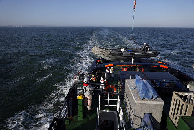 A rescue boat is prepared to help migrants following a problem with their boat’s engine in French waters.