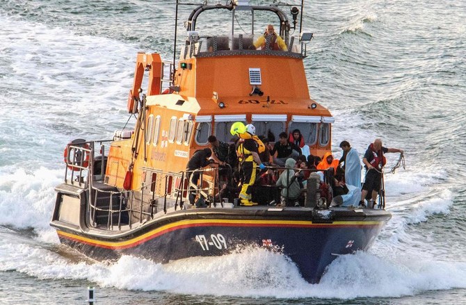 Migrants picked up at sea while attempting to cross English Channel, are brought by a lifeboat into the Marina in Dover