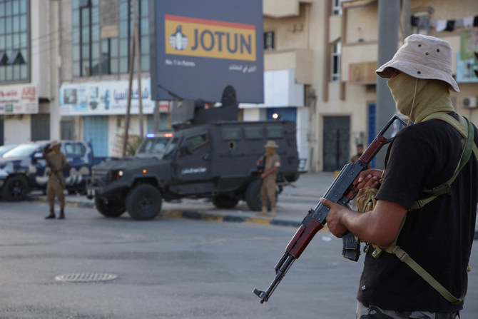 Members of security personnel affiliated with the Ministry of Interior secure the streets after Tuesday’s clashes in Tripoli. 