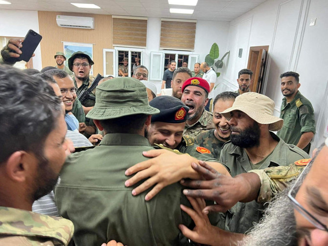 Members of the 444th Brigade receive commander Mahmoud Hamza.