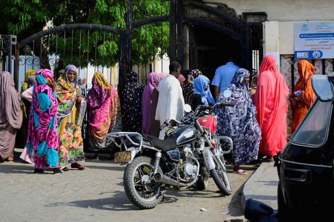 Sudanese families wait outside a hospital while doctors and medical staff strike to protest late salaries in Khartoum, Sudan. 