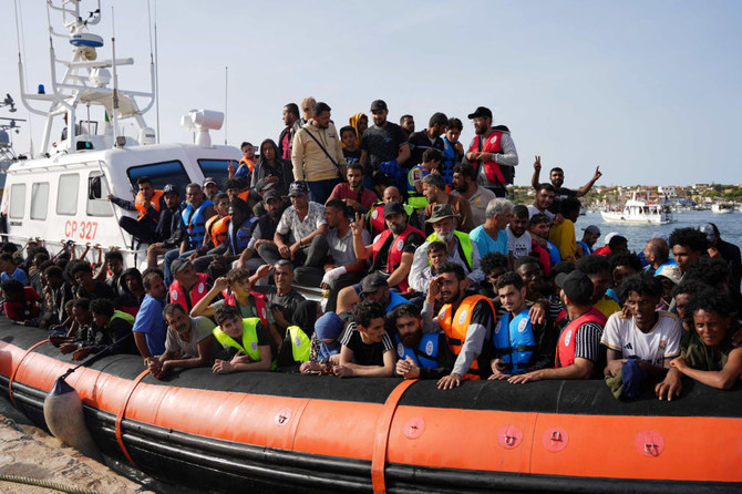 Migrants arrive in the harbour of Italian island of Lampedusa, on September 18, 2023. (AFP)