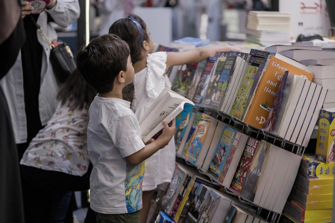 Children select books at the Riyadh International Book Fair. (File/AN photo/Huda Bashatah)