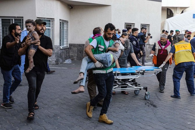 Children injured in an Israeli strike are rushed to the Al-Shifa hospital in Gaza City on October 15, 2023. (AFP)