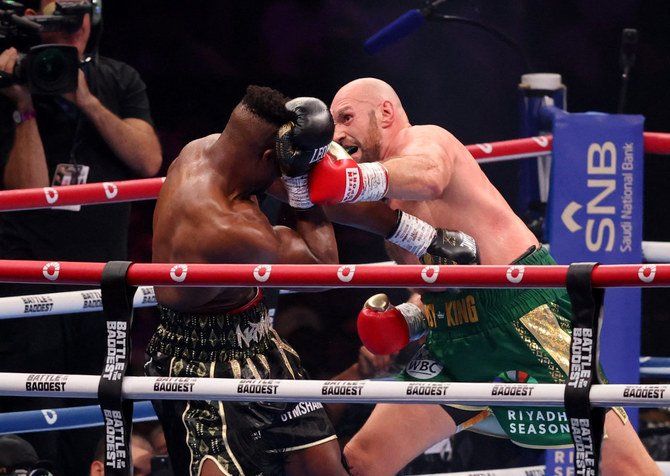 Tyson Fury survives scare from former UFC fighter Ngannou to win split decision in ‘Battle of the Baddest’