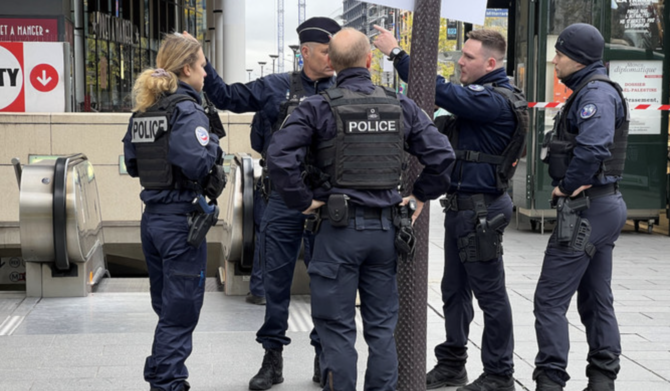 Police stand outside the Bibliotheque Francois Mitterrand metro and regional train station in Paris, France, October 31, 2023. 