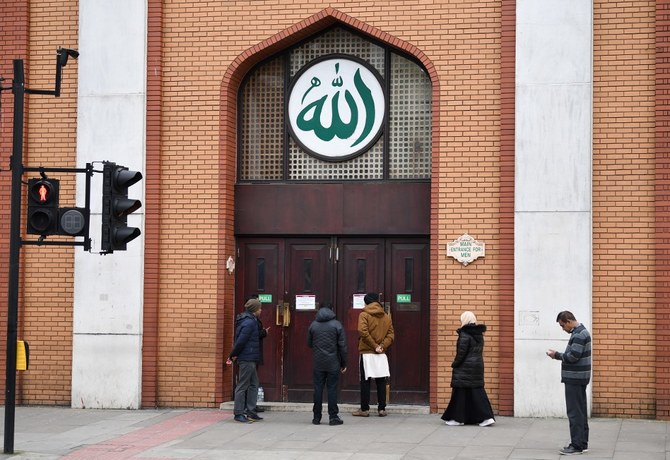 Muslims can be seen outside the East London Mosque in London, England. (File/AFP)