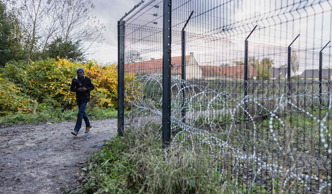 ’Mud to our knees’: teen migrant misery in France’s Calais