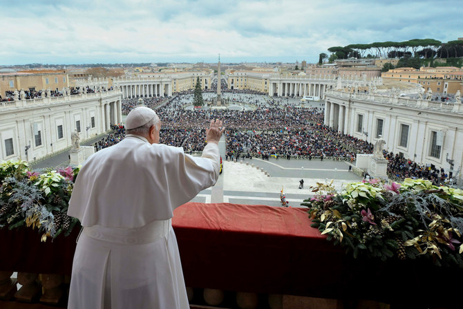 Pope Francis gestures as he delivers his traditional Christmas Day Urbi et Orbi message.