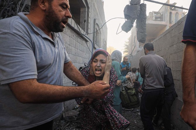 People flee following Israeli air strikes on a neighbourhood in the Al-Maghazi refugee camp in the central Gaza Strip. (File/AFP