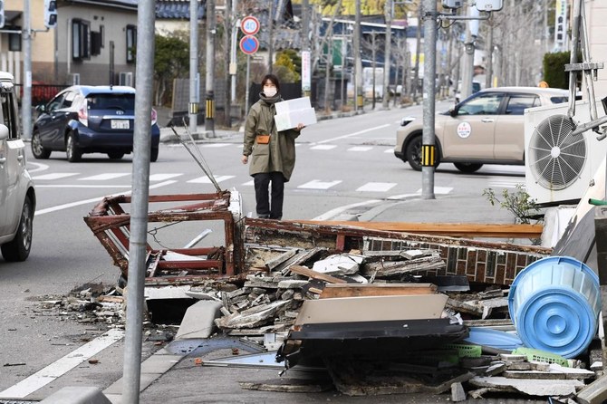 Death toll reaches 100 as survivors are found in homes smashed by western Japan earthquakes