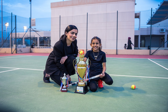 Sama Al-Bakr poses with a trophy. (AN photo by Nisar Illikkottil)