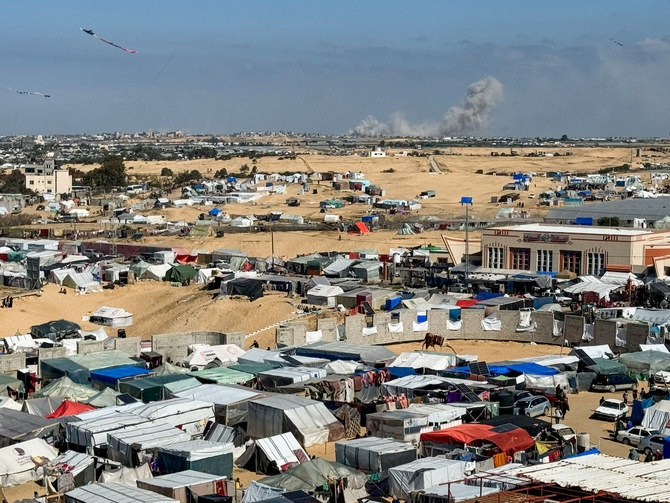 Smoke rises during Israeli ground operation in Khan Younis, as seen from a tent camp sheltering displaced Palestinians in Rafah.