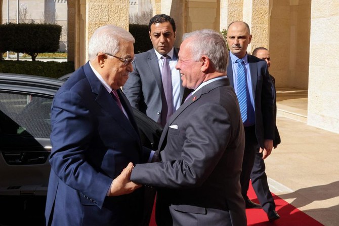 This picture shows President Mahmud Abbas (L) being welcomed by Jordan's King Abdullah II ahead of their meeting in Amman.