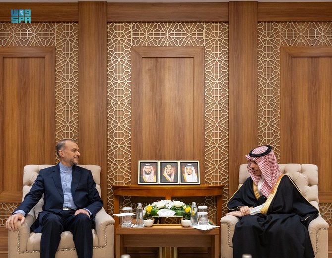 Saudi Arabia’s Foreign Minister Prince Faisal bin Farhan shakes hands with Iranian Foreign Minister Hossein Amir-Abdollahian.