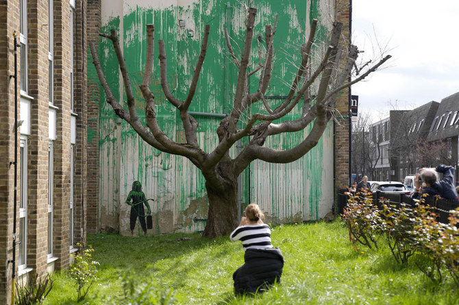 Banksy mural to be protected after London paint attack