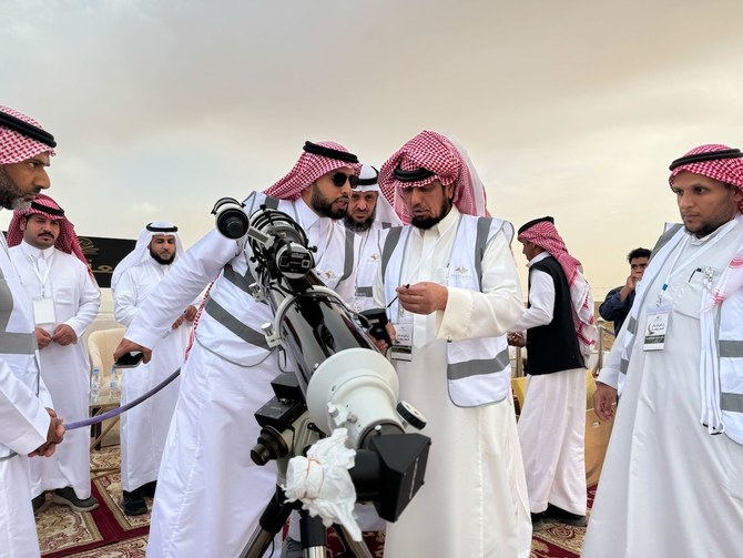 Saudi astronomer Abdullah Al-Khudairi, director of the Astronomy Observatory in Sudair, prepares to sight the crescent moon. 