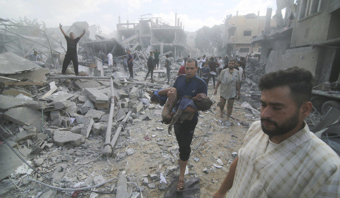 Palestinians evacuate the wounded after an Israeli bombardment of Rafah, southern Gaza Strip, Tuesday, Oct. 17, 2023. (AP)