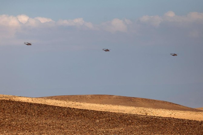 Israeli Air Force heavy lift military transport helicopters fly over in the southern Negev desert on April 14, 2024. (AFP)