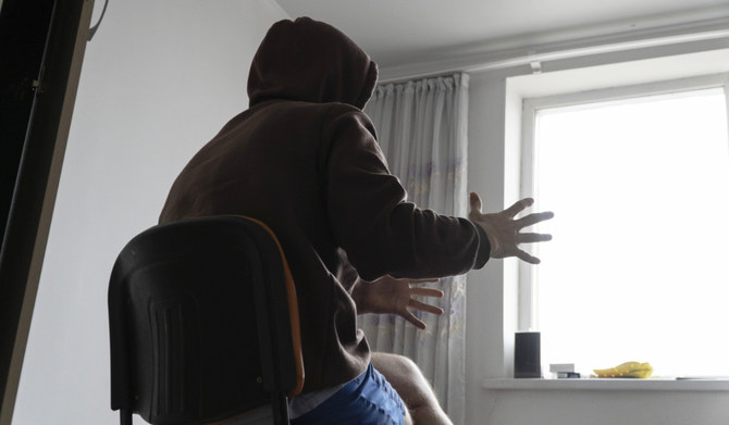 A Russian officer who goes by Yevgeny speaks during an interview at his apartment in Astana, Kazakhstan, in late 2023. (AP)