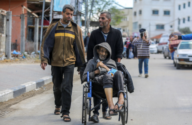 People flee the eastern parts of Rafah after the Israeli military began evacuating Palestinian civilians.