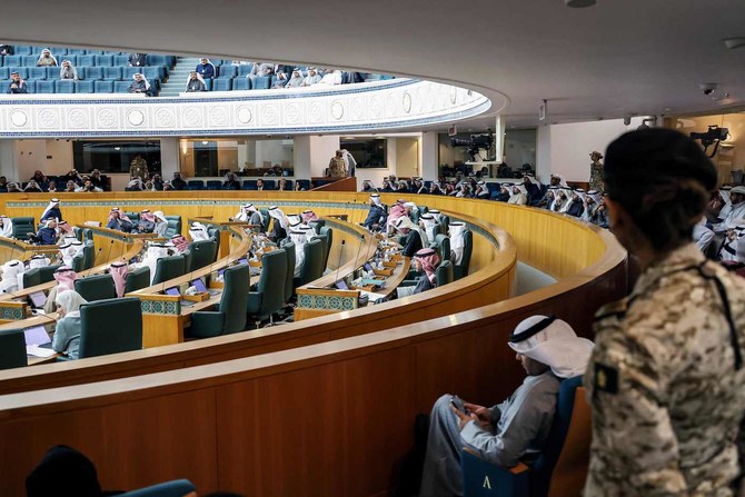 Female security guard stands by as Kuwaiti lawmakers attend a parliament session at the National Assembly in Kuwait City. 