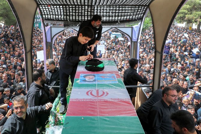 The coffin of late Iranian president Ebrahim Raisi during a funeral procession in the eastern city of Birjand on May 23, 2024.