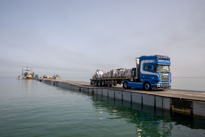 More aid getting from US pier to people in Gaza, officials say, after troubled launch