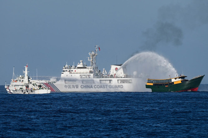 China says it saw armed Philippine personnel on vessel in disputed South China Sea