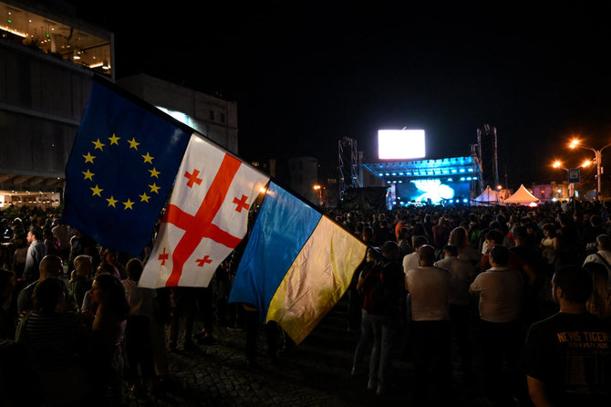 Georgia’s parliament speaker signs a divisive foreign influence bill into law