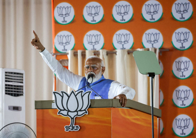 India's Prime Minister Narendra Modi gestures as he addresses supporters during an election campaign rally, in New Delhi, India.