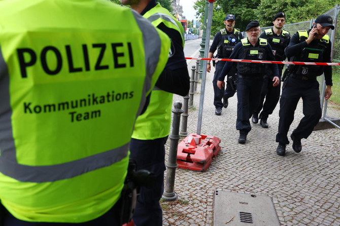 German police shoot to death an Afghan man who killed a compatriot, then attacked soccer fans