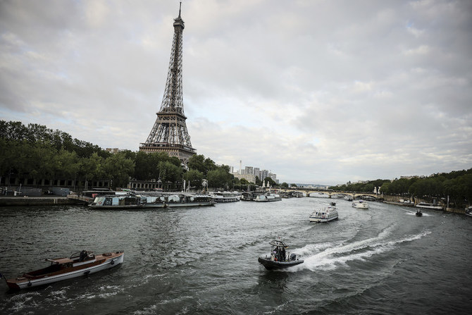 Boats cruise the Seine river in a rehearsal for the Paris Olympics’ opening ceremony