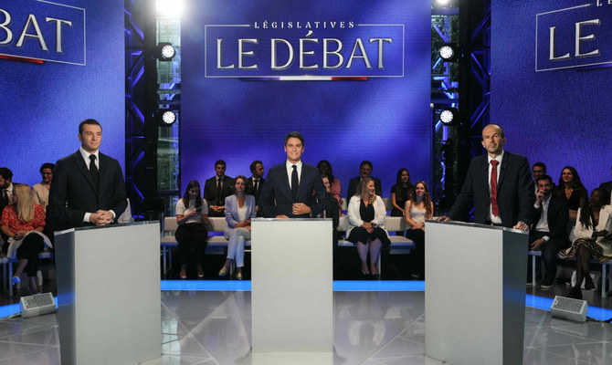 French PM, far-right chief cross swords in raucous election debate