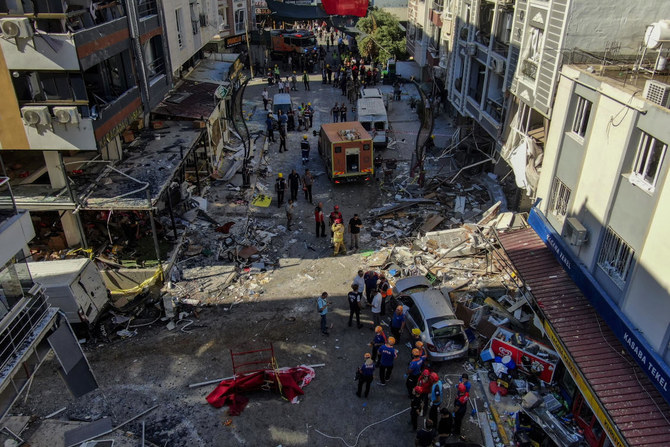 Firefighters and emergency team members work during the aftermath of an explosion in a restaurant in Izmir, western Turkiye.