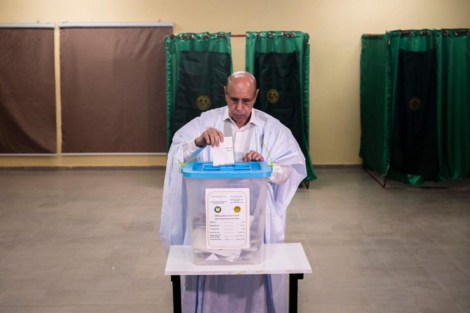 Incumbent Mauritanian President Mohamed Ould Ghazouani casts his ballot at a polling station in Nouakchott on June 29, 2024. AFP