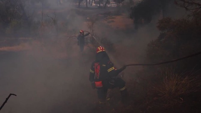 Firefighters battle wildfires on 2 Greek islands as premier warns of a dangerous summer
