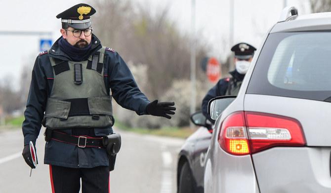 Italian Carabinieri police officers hold a road check point in Valsamoggia near Bologna. (AFP file photo)