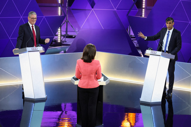 Labour Party leader Keir Starmer and Britain’s Prime Minister and Conservative Party leader Rishi Sunak attend a live TV debate.