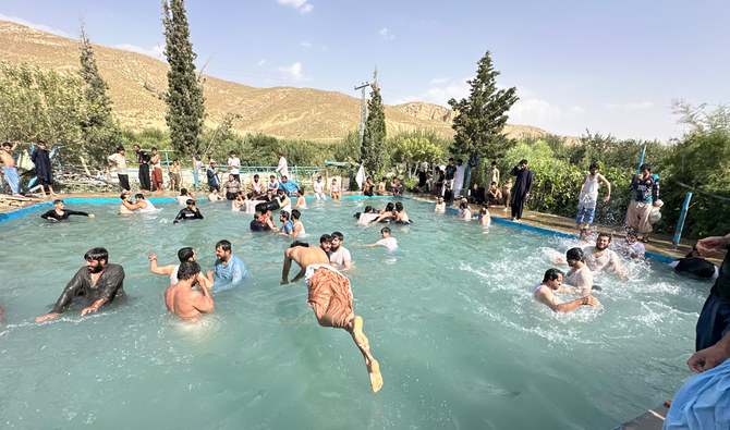 In southwest Pakistan, people turn to fresh water pools to beat the heat